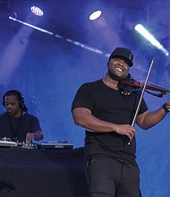 A member of the Florida-based hip hop duo Black Violin shows the crowd what he’s got at the 10th Annual Richmond Jazz and Music Festival at Maymont.