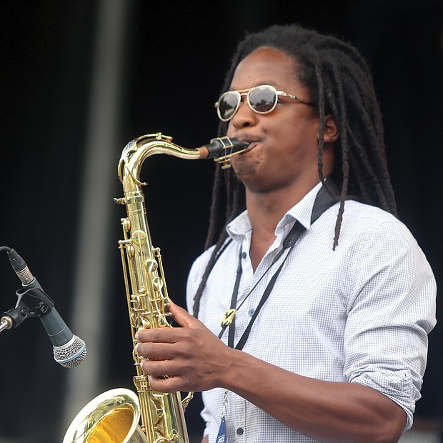 The saxophonist from the Richmond- based brass ensemble Brunswick blows during a number on Saturday at the 10th Annual Richmond Jazz and Music Festival at Maymont.