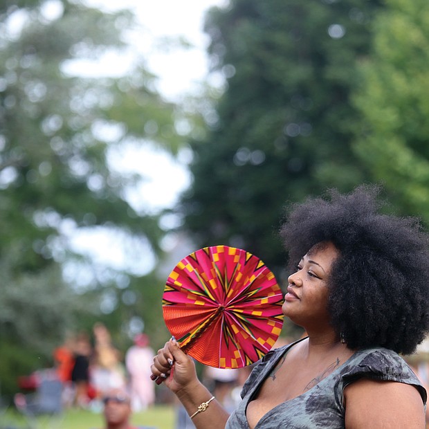 A fan with a fan at the 10th Annual Richmond Jazz and Music Festival at Maymont