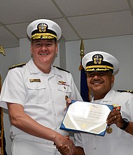 Rear Adm. Charles W. Rock, Commander, Navy Region Mid-
Atlantic, presents Cmdr. Christopher J. Tejeda, right, with 
Meritorious Service Medal during change of command  
ceremony for his tenure as commanding officer for 
NSA Saratoga Springs.