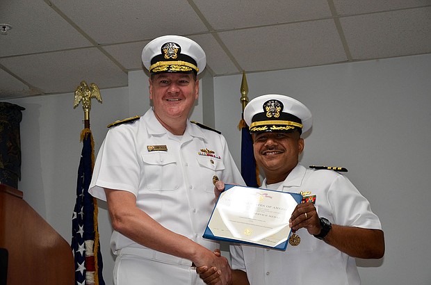 Rear Adm. Charles W. Rock, Commander, Navy Region Mid-
Atlantic, presents Cmdr. Christopher J. Tejeda, right, with 
Meritorious Service Medal during change of command  
ceremony for his tenure as commanding officer for 
NSA Saratoga Springs.
