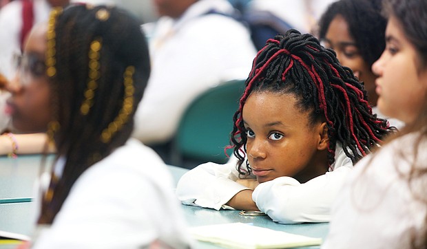 Cheyenne listens intently on the first day of classes at Cristo Rey Richmond High School. The school is located in the Museum District on Sheppard Street in the former home of Benedictine High School.