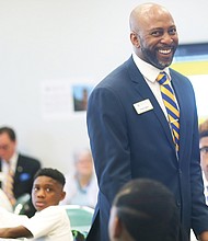 Corey Taylor, principal of Cristo Rey Richmond High School, welcomes members of the school’s inaugural class Monday and sets expectations for the academic year.