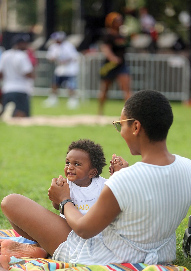All smiles/
Eight-month-old Henry Tidwell was all smiles last Saturday as he and his mother, Whitney Tidwell, took in the sights and sounds at the 29th Annual Down Home Family Reunion at Abner Clay Park in Jackson Ward. (Regina H. Boone/Richmond Free Press)