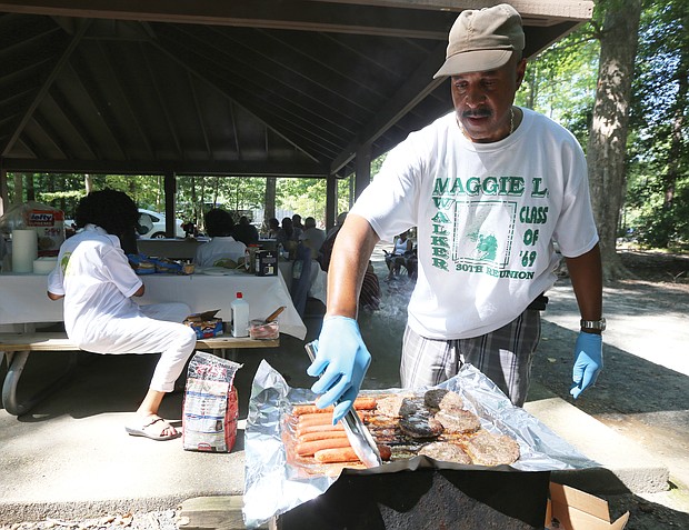 Green Dragons celebrate golden reunion/
The golden anniversary reunion wrapped up last Sunday with the cookout at Dorey Park in Henrico County, where classmate Elwood Sookins Jr. takes charge of the grill.
The reunion committee organized three days of events that included a tour of the old high school on Lombardy Street; a class photo taken at the statue of Maggie Walker on Broad Street in Downtown; dinner and dancing at a Henrico hotel last Friday and Saturday; a candle lighting ceremony to remember deceased classmates; and a worship service at St. Peter Baptist Church on Mountain Road in Glen Allen. (Regina H. Boone/Richmond Free Press)