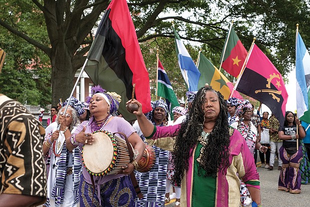 African-American dancers, drummers and flag bearers parade at Fort Monroe on Saturday following more than two hours of speeches. (photo by Ava Reaves)