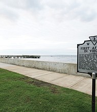 A state historial marker outlining the history of the “First Africans in Virginia” stands near the seawall at the Fort Monroe National Historic Site. The area was known as Point Comfort in 1619 when the “20 and odd Negroes,” captured by the Portugese in Africa and then stolen by pirates on the English ship White Lion, were traded in Virginia for food and provisions. (Regina H. Boone/Richmond Free Press)