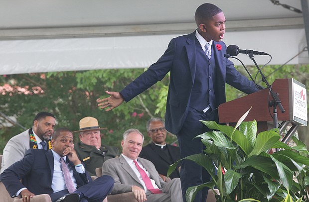 Brycen Dildy, 11, of Larkspur Middle School in Virginia Beach, wows the crowd as he speaks during last Saturday’s main commemoration ceremony at Fort Monroe. (Regina H. Boone/Richmond Free Press)