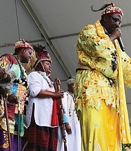 Water is poured from an animal horn during a traditional libation ceremony Saturday by representatives of various African nations. (Regina H. Boone/Richmond Free Press)