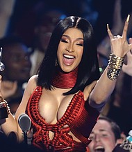 Cardi B delightedly accepts the Best Hip-Hop Video Award for “Money,” beating out a lineup of male competitors.