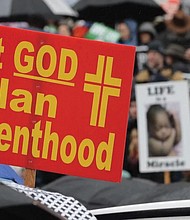 A sign conveys an anti-abortion message at a rally on Jan. 22, 2019, at the Capitol in Olympia, Wash. The
event was part of annual “March for Life” events held in various states and Washington, D.C., on the Jan. 22, 1973, anniversary of the Supreme Court’s Roe v. Wade decision, which legalized abortion.