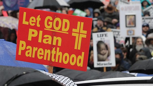 A sign conveys an anti-abortion message at a rally on Jan. 22, 2019, at the Capitol in Olympia, Wash. The
event was part of annual “March for Life” events held in various states and Washington, D.C., on the Jan. 22, 1973, anniversary of the Supreme Court’s Roe v. Wade decision, which legalized abortion.