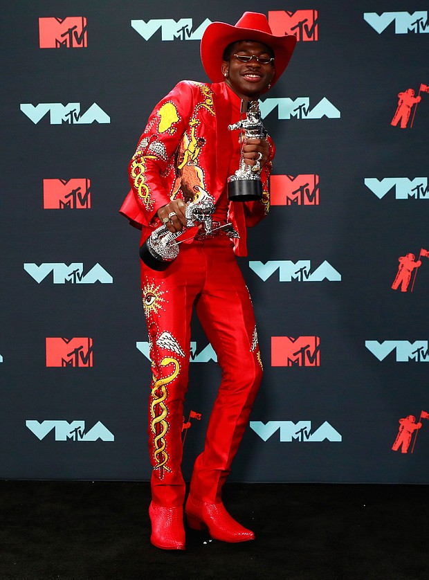 Lil Nas X shows off his awards, including the Song of the Year Award for “Old Town Road (remix).”
