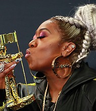 Missy ElliotT shows love for her Michael Jackson Video Vanguard Award for lifetime achievement on Monday backstage at the MTV Video Music Awards at the Prudential Center in Newark, N.J.