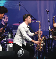 Saxophonists Paul Taylor, Vincent Ingala and Michael Lington of Sax to the Max rock the arena. (photo by Randy Singleton)