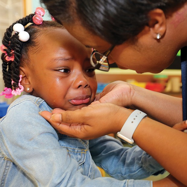 Kindergartner Alonna Smyre, 5, gives her mother, Shartisha White, a tearful goodbye Tuesday as she goes to school for the first time. Her mother said the youngster was excited about starting school at Westover Hills Elementary and claimed she wouldn’t be nervous. But once inside, the tears flowed and the hugs got tighter as she didn’t want her mom to leave.