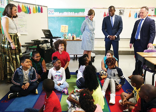 Teacher Abbie Radcliffe, standing at left, and her fourth-grade class at Westover Hills Elementary School welcome Principal Allison El Koubi, Richmond Mayor Levar M. Stoney and Richmond Public Schools Superintendent Jason Kamras on the first day of school.