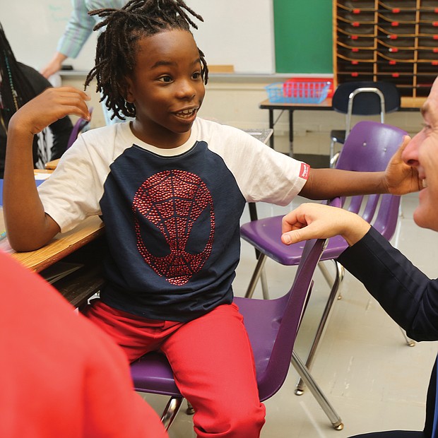 Fifth-grader Akai Dupree Jr., 10, talks with Richmond Public Schools Superintendent Jason Kamras at Westover Hills Elementary School as classes start for the new academic year.