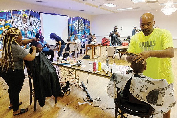 At Cedar Street Baptist Church of God in the East End, youngsters were treated to a Barber and Beauty Day on Monday to get ready for school. A team of professional stylists and barbers worked with youngsters from pre-kindergarten through 12th grade.
