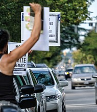 Black Lives Matter activist Jalene Schmidt takes part in a protest last Sunday outside the national headquarters of the United Daughters of the Confederacy on Arthur Ashe Boulevard.