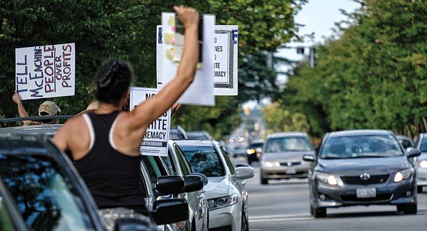 Black Lives Matter activist Jalene Schmidt takes part in a protest last Sunday outside the national headquarters of the United Daughters of the Confederacy on Arthur Ashe Boulevard.