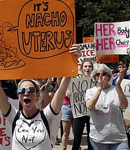 A group gathers to protest abortion restrictions at the State Capitol in Austin, Texas/AP Eric Gay