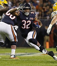 Chicago Bears running back David Montgomery (32) rushes in the first quarter against the Green Bay Packers at Soldier Field in Chicago on  Sept. 5, 2019
