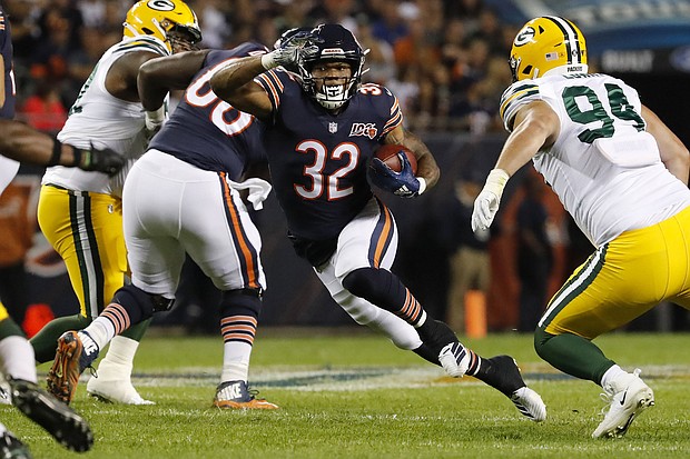 Chicago Bears running back David Montgomery (32) rushes in the first quarter against the Green Bay Packers at Soldier Field in Chicago on  Sept. 5, 2019