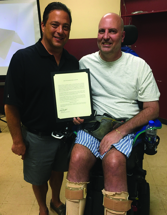 Illinois State Representative Robert Rita (left) recently signed a proclamation recognizing September as Recovery Month and acknowledged the importance of offering substance abuse and addiction recovery services. Photo Credit: Provided by the Office of State Representative Robert Rita