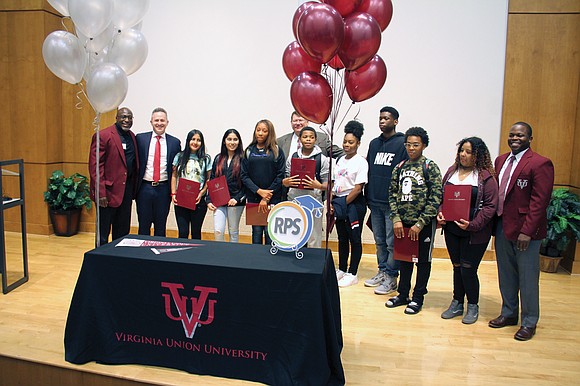 Tuesday was a red-letter day for nine Huguenot High School ninth-graders. The stage in a school assembly hall was set ...