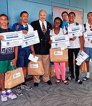 HU President Dr. William Harvey with Bahamian students