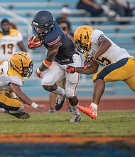 Virginia State University freshman running back Darius Hagans goes in for a 2-yard touchdown during the first quarter of the Trojans’ game against Johnson C. Smith University last Saturday at Rogers Stadium in Ettrick.