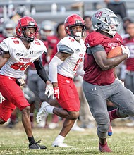 Virginia Union University running back Tabyus Taylor gets past a stunned Winston- Salem State University defense last Saturday at Hovey Field in Richmond.