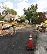 The Fulton neighborhood in the East End is one of the first to get new paving as part of a $15 million program City Hall is undertaking during the current 2019-20 budget year. While one lane on Carlisle Avenue is complete, a city crew on Monday repairs the second lane at the intersection of Carlisle Avenue and Malone Street before repaving.