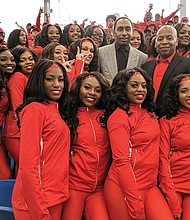 Popular ESPN sports analyst Stephen A. Smith, above center, poses with Winston-Salem State University Chancellor Elwood Robinson and the Red Sea of Sound after an athletic scholarship was named in Smith’s honor. Smith, who graduated from Winston-Salem State in 1991, played basketball under legendary Coach Clarence “Big House” Gaines.