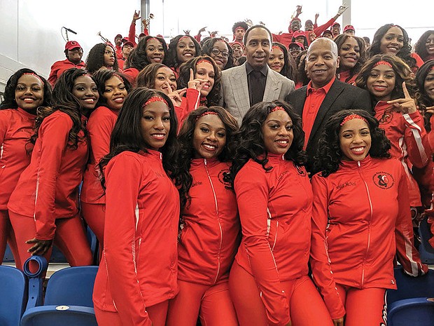 Popular ESPN sports analyst Stephen A. Smith, above center, poses with Winston-Salem State University Chancellor Elwood Robinson and the Red Sea of Sound after an athletic scholarship was named in Smith’s honor. Smith, who graduated from Winston-Salem State in 1991, played basketball under legendary Coach Clarence “Big House” Gaines.