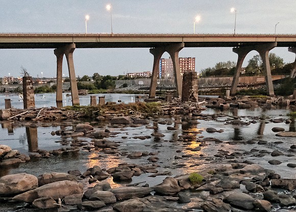 Rocks typically covered by the rushingwaters of the James River are now visible because of low water levels.