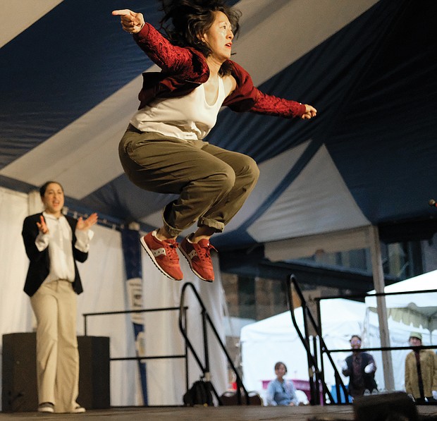 Lots of music, lots of folk/Richmond’s Downtown riverfront came alive with people and music last weekend as thousands of people turned out for the Richmond Folk Festival. A member of Urban Artistry DC showcases hip-hop and house dance during an exhibition performance Saturday evening. (Sandra Sellars/Richmond Free Press)