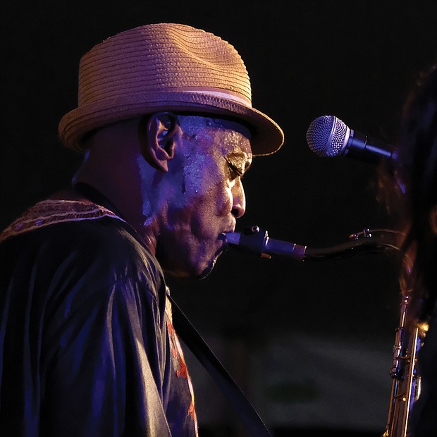 Lots of music, lots of folk/Richmond’s Downtown riverfront came alive with people and music last weekend as thousands of people turned out for the Richmond Folk Festival. Richmond’s own James “Plunky” Branch, left, sets an Afro-funk groove on the saxophone with his group, Plunky & the Oneness of Juju, on Saturday night. (Sandra Sellars/Richmond Free Press)