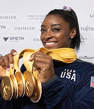U.S. gymnast Simone Biles shows off the five gold medals she won at the Gymnastics World Championships in Stuttgart, Germany, making her the world’s most decorated gymnast with a cumulative 25 medals.