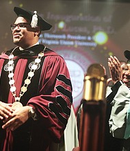 Dr. Hakim J. Lucas is applauded by an audience of hundreds and his mother, Bishop Barbara Austin Lucas, during his inauguration as Virginia Union University’s 13th president during a ceremony Oct. 17 at the Greater Richmond Convention Center. Bishop Lucas is founder and senior pastor of Agape Tabernacle International Fellowship in Brooklyn, N.Y.