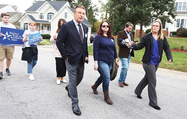Election star power: 
With reporters in tow, popular movie and TV actor Alec Baldwin stumps for votes on Tuesday with Democratic state Senate candidate Amanda Pohl, right, and her supporters in a Midlothian subdivision in Chesterfield County. Mr. Baldwin came to rally support
for Ms. Pohl, who is seeking to upset Republican incumbent Sen. Amanda Chase in
the 11th Senate District. Along with the visit to the Richmond suburb, Mr. Baldwin also made campaign stops for candidates in Fredericksburg and Fairfax County. His one-day electioneering trip to Virginia was organized by People for the American Way, which has endorsed the Democratic candidates.