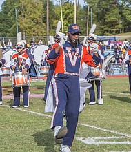 A drum major with the VSU Trojan Explosion Marching Band takes the first steps onto the field at Rogers Stadium in Ettrick. Recent restrictions were lifted on the band, allowing the musicians to participate in homecoming.