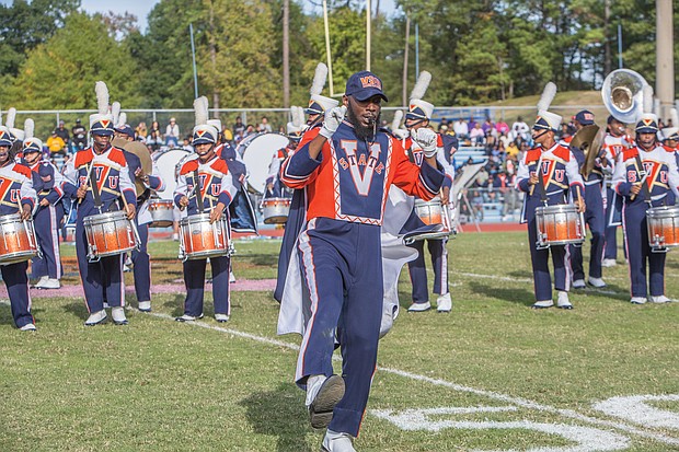 A drum major with the VSU Trojan Explosion Marching Band takes the first steps onto the field at Rogers Stadium in Ettrick. Recent restrictions were lifted on the band, allowing the musicians to participate in homecoming.