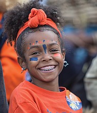 Emma Hairston, 10, is dressed head to toe in the colors of VSU — orange and blue.