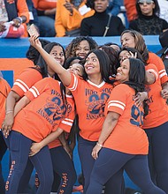 Alumni members of the VSU Woo Woos cheerleading squad celebrating their 20th anniversary pause for a selfie on the sidelines at Rogers Stadium. The former cheerleaders were invited to participate in some of the cheers during the game.