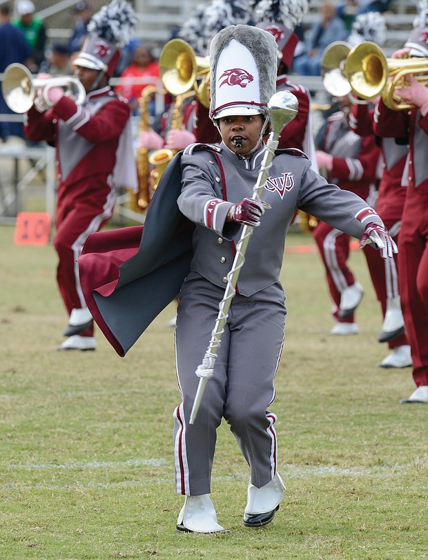 Diamond McGhee, one of two drum majors with the VUU Ambassadors of Sound Marching Band, takes charge during the halftime show at Hovey Field.