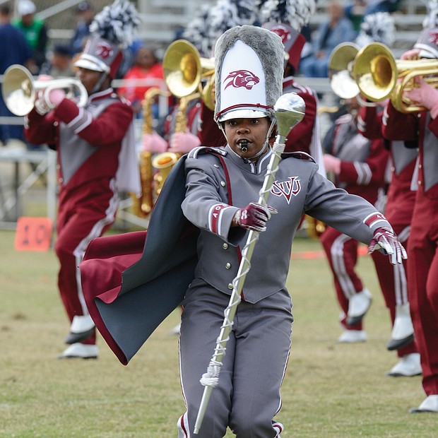 Diamond McGhee, one of two drum majors with the VUU Ambassadors of Sound Marching Band, takes charge during the halftime show at Hovey Field.