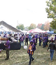 Members of the Omega Psi Phi Fraternity Zeta Chapter, celebrating their 100th anniversary last weekend join scores of people for the tailgating before and after the football game against Chowan University.