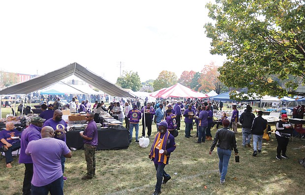 Members of the Omega Psi Phi Fraternity Zeta Chapter, celebrating their 100th anniversary last weekend join scores of people for the tailgating before and after the football game against Chowan University.